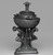 Josiah Wedgwood & Sons Ltd. (founded 1759). <em>Oil Lamp</em>. Basalt (stoneware), 13 1/2 × 7 1/2 × 7 1/4 in. (34.3 × 19.1 × 18.4 cm). Brooklyn Museum, Gift of Emily Winthrop Miles, 55.25.3a. Creative Commons-BY (Photo: Brooklyn Museum, 55.25.3a_edited_PS2.jpg)