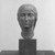 Oscar Miestchaninoff (American, born Russia, 1886-1956). <em>Head of a Young Bulgarian</em>, 1920. Bronze with stone base, 19 3/8 x 7 1/2 x 9 3/4 in. (49.2 x 19.1 x 24.8 cm). Brooklyn Museum, Gift of Mrs. Oscar Miestchaninoff, 58.183. Creative Commons-BY (Photo: Brooklyn Museum, 58.183_front_acetate_bw.jpg)
