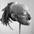Iatmul. <em>Ancestral Skull</em>, early 20th century. Human skull, clay, pigment, cowrie shells, human hair, 8 1/2 x 7 1/2 x 9 1/4 in. (21.6 x 19.1 x 23.5 cm). Brooklyn Museum, Frank L. Babbott Fund, 62.18.1. Creative Commons-BY (Photo: Brooklyn Museum, 62.18.1_threequarter_acetate_bw.jpg)