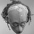 Iatmul. <em>Ancestral Skull</em>, early 20th century. Human skull, clay, pigment, cowrie shells, human hair, 8 1/2 x 7 1/2 x 9 1/4 in. (21.6 x 19.1 x 23.5 cm). Brooklyn Museum, Frank L. Babbott Fund, 62.18.1. Creative Commons-BY (Photo: Brooklyn Museum, 62.18.1_top_acetate_bw.jpg)