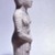  <em>Standing Woman</em>, 20th century (probably). Limestone, pigment, 16 9/16 x 6 1/16 x 3 11/16 in. (42.1 x 15.4 x 9.3 cm). Brooklyn Museum, Charles Edwin Wilbour Fund, 63.36. Creative Commons-BY (Photo: Brooklyn Museum, 63.36_side.jpg)