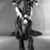 Bau. <em>Female Figure</em>. Plaited rattan, wood, feathers, shell, and raffia, 72 1/16 in.  (183.0 cm). Brooklyn Museum, A. Augustus Healy Fund, 66.128.2. Creative Commons-BY (Photo: Brooklyn Museum, 66.128.2_acetate_bw.jpg)