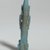  <em>Figure of Nefertum</em>, 305-30 B.C.E. Faience, 3 7/16 x 1 1/4 x 9/16 in. (8.8 x 3.2 x 1.4 cm). Brooklyn Museum, Charles Edwin Wilbour Fund, 71.142. Creative Commons-BY (Photo: Brooklyn Museum, 71.142_back_PS2.jpg)