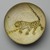  <em>Bowl Depicting a Cheetah</em>, 10th century. Ceramic; earthenware, painted in yellow-staining black slip on a white slip ground under a transparent glaze, 3 3/8 x 8 7/8 in. (8.5 x 22.5 cm). Brooklyn Museum, Frederick Loeser Fund, 73.165. Creative Commons-BY (Photo: Brooklyn Museum, 73.165_top_PS2.jpg)