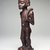 Chokwe. <em>Female Figure with Horn (Kaponya)</em>, late 19th century. Wood, copper alloy, 12 1/4 x 3 1/2 x 3 1/4 in. (31.1 x 8.9 x 8.3 cm). Brooklyn Museum, Gift of Marcia and John Friede, 74.89. Creative Commons-BY (Photo: Brooklyn Museum, 74.89_side.jpg)