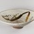  <em>Bowl</em>, 18th century. Glazed stoneware with white slip and underglaze iron decoration; Futagawa  or Takeo Karatsu ware, 6 3/8 x 19 7/8 in. (16.2 x 50.5 cm). Brooklyn Museum, Gift of the Tokio Marine and Fire Insurance Co. Ltd., 75.124. Creative Commons-BY (Photo: Brooklyn Museum, 75.124_overall_PS20.jpg)