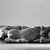  <em>Recumbent Ibex</em>. Limestone, 13 7/16 x 5 1/4 x overall length 17 13/16 in. (34.2 x 13.4 x 45.3 cm). Brooklyn Museum, Anonymous gift, 75.53. Creative Commons-BY (Photo: Brooklyn Museum, 75.53_bottom_bw.jpg)