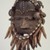 We. <em>Face Mask</em>, late 19th or early 20th century. Wood, cloth, copper alloy, shells, hair, cordage, ferrous nails, accumulated materials, 12 x 8 1/4 x 5 1/4 in. (30.5 x 21 x 13.3 cm). Brooklyn Museum, Gift of Mr. and Mrs. J. Gordon Douglas III, 77.173.4. Creative Commons-BY (Photo: Brooklyn Museum, 77.173.4.jpg)