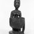 Yorùbá. <em>Kneeling Female Figure Holding a Bowl (Agere Ifa)</em>, late 19th or early 20th century. Wood, applied materials, (metal & beads in bag), h: 11 3/3 in. (30.0 cm). Brooklyn Museum, Gift of Ann W. Walzer, 80.245. Creative Commons-BY (Photo: Brooklyn Museum, 80.245_front_bw.jpg)
