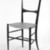 Botti and Gandolfo. <em>Charivari Side Chair</em>, 1950s. Ebonized wood with cane seat, 34 1/8 x 15 1/4 x 14 1/2 in. (86.7 x 38.7 x 36.8 cm). Brooklyn Museum, Gift of Christopher Brent, 84.5.2. Creative Commons-BY (Photo: Brooklyn Museum, 84.5.2_bw.jpg)