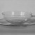 Wilhelm Wagenfeld (1900-1990). <em>Cup and Saucer</em>, 1930-1934. Clear heat-resistant glass, 1 3/8 x 5 1/8 x 3 7/8 in. (3.5 x 13 x 9.8 cm). Brooklyn Museum, Gift of Barry Friedman, 84.64.5a-b. Creative Commons-BY (Photo: Brooklyn Museum, 84.64.5a-b_bw.jpg)