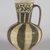  <em>Jug</em>, mid-12th century. Ceramic; earthenware, painted in black slip and white engobe under a transparent glaze, 6 3/4 x 4 1/2 in. (17.2 x 11.5 cm). Brooklyn Museum, Gift of the Ernest Erickson Foundation, Inc., 86.227.77. Creative Commons-BY (Photo: Brooklyn Museum, 86.227.77_PS5.jpg)