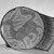  <em>Fragment of a Plate</em>, 11th century. Ceramic, monochrome lusterware, pink earthenware body, Diameter: 8 5/8 x 2 5/16 in. (21.9 x 5.8 cm). Brooklyn Museum, Gift of the Ernest Erickson Foundation, Inc., 86.227.82. Creative Commons-BY (Photo: Brooklyn Museum, 86.227.82_acetate_bw.jpg)