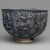 Hasan Al-Qashani. <em>Octagonal Bowl with Inscriptions</em>, late 12th century. Ceramic; fritware, with carved and molded decoration under a cobalt blue glaze, 4 5/16 x 6 3/8 in. (11 x 16.2 cm). Brooklyn Museum, Gift of the Ernest Erickson Foundation, Inc., 86.227.89. Creative Commons-BY (Photo: Brooklyn Museum, 86.227.89_side2_PS2.jpg)