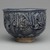 Hasan Al-Qashani. <em>Octagonal Bowl with Inscriptions</em>, late 12th century. Ceramic; fritware, with carved and molded decoration under a cobalt blue glaze, 4 5/16 x 6 3/8 in. (11 x 16.2 cm). Brooklyn Museum, Gift of the Ernest Erickson Foundation, Inc., 86.227.89. Creative Commons-BY (Photo: Brooklyn Museum, 86.227.89_side3_PS2.jpg)