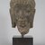  <em>Head of Buddha</em>, 8th century. Sandstone, 12 1/2 x 7 1/2 x 7 3/4 in. (31.8 x 19.1 x 19.7 cm). Brooklyn Museum, Gift of Mr. and Mrs. Robert L. Poster, 86.274. Creative Commons-BY (Photo: Brooklyn Museum, 86.274_PS5.jpg)