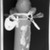 Yaka. <em>Slit-Drum Hunting Charm (N-kookwa Ngoombu)</em>, 19th century. Wood, iron, seedpods, fiber, horn, fur, glass, beads, organic material, 12 3/16 x 2 3/4 x 2 in. (31 x 7 x 5.1 cm). Brooklyn Museum, Museum Expedition 1922, Robert B. Woodward Memorial Fund, 22.1461. Creative Commons-BY (Photo: Brooklyn Museum, CONS.22.1461_1994_xrs_detail01.jpg)