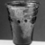 Roman. <em>Goblet with Blue Dots</em>, 4th-early 5th century C.E. Glass, 3 7/16 x greatest diam. 3 1/16 in. (8.8 x 7.7 cm) . Brooklyn Museum, Gift of Robert B. Woodward, 01.129. Creative Commons-BY (Photo: Brooklyn Museum, CUR.01.129_negA_bw.jpg)