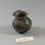 Roman. <em>Small Vase of Plain Blown Deep Amethyst Glass</em>, 4th-12th century C.E. Glass, 1 5/8 x Diam. 1 3/4 in. (4.2 x 4.4 cm). Brooklyn Museum, Gift of Robert B. Woodward, 01.186. Creative Commons-BY (Photo: Brooklyn Museum, CUR.01.186_view2.jpg)