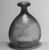 Roman. <em>Bottle of Blown Glass</em>, 3rd-7th century C.E. Glass, 4 x Diam. 3 3/8 in. (10.1 x 8.6 cm). Brooklyn Museum, Gift of Robert B. Woodward, 01.218. Creative Commons-BY (Photo: Brooklyn Museum, CUR.01.218_negA_bw.jpg)