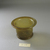 Roman. <em>Cup of Blown Yellow Glass</em>, 1st century C.E. Glass, 1 7/8 x Diam. 3 1/16 in. (4.8 x 7.7 cm). Brooklyn Museum, Gift of Robert B. Woodward, 01.24. Creative Commons-BY (Photo: Brooklyn Museum, CUR.01.24.jpg)