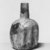 Roman. <em>Bottle with Folded Body Decoration</em>, 4th-12th century C.E. Glass, 4 7/8 x Diam. 3 3/16 in. (12.4 x 8.1 cm). Brooklyn Museum, Gift of Robert B. Woodward, 01.261. Creative Commons-BY (Photo: Brooklyn Museum, CUR.01.261_negA_bw.jpg)
