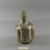 Roman. <em>Bottle with Folded Body Decoration</em>, 4th-12th century C.E. Glass, 4 7/8 x Diam. 3 3/16 in. (12.4 x 8.1 cm). Brooklyn Museum, Gift of Robert B. Woodward, 01.261. Creative Commons-BY (Photo: Brooklyn Museum, CUR.01.261_view1.jpg)