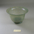 Roman. <em>Cup of Molded Green Glass</em>, 3rd-4th century C.E. Glass, 2 5/8 x greatest diam. 4 1/4 in. (6.7 x 10.8 cm). Brooklyn Museum, Gift of Robert B. Woodward, 01.326. Creative Commons-BY (Photo: Brooklyn Museum, CUR.01.326.jpg)