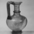 Roman. <em>Jug with Handle</em>, late 3rd-4th century C.E. Glass, 6 15/16 x Diam. 4 1/2 in. (17.6 x 11.4 cm). Brooklyn Museum, Gift of Robert B. Woodward, 01.344. Creative Commons-BY (Photo: Brooklyn Museum, CUR.01.344_negA_bw.jpg)
