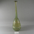 Roman. <em>Bottle of Heavy Mold Glass</em>, 1st-3rd century C.E. Glass, 11 1/4 x Diam. 3 5/16 in. (28.6 x 8.4 cm). Brooklyn Museum, Gift of Robert B. Woodward, 01.414. Creative Commons-BY (Photo: Brooklyn Museum, CUR.01.414_view1.jpg)