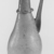 Roman. <em>Flask with Handle and Diagonal Ribs</em>, 3rd-4th century C.E. Glass, 6 5/8 x Diam. 2 1/2 in. (16.9 x 6.3 cm). Brooklyn Museum, Gift of Robert B. Woodward, 01.436. Creative Commons-BY (Photo: Brooklyn Museum, CUR.01.436_negA_bw.jpg)