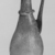 Roman. <em>Flask with Handle and Diagonal Ribs</em>, 3rd-4th century C.E. Glass, 6 5/8 x Diam. 2 1/2 in. (16.9 x 6.3 cm). Brooklyn Museum, Gift of Robert B. Woodward, 01.436. Creative Commons-BY (Photo: Brooklyn Museum, CUR.01.436_negB_bw.jpg)