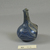 Roman. <em>Bottle of Blown Glass</em>, 3rd-4th century C.E. Glass, 2 5/8 x Diam. 2 in. (6.6 x 5.1 cm). Brooklyn Museum, Gift of Robert B. Woodward, 01.52. Creative Commons-BY (Photo: Brooklyn Museum, CUR.01.52_view2.jpg)