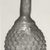 Roman. <em>Bottle with Stylized Grape Pattern</em>, 3rd century C.E. Glass, 2 5/8 x 5 11/16 in. (6.6 x 14.4 cm). Brooklyn Museum, Gift of Robert B. Woodward, 01.57. Creative Commons-BY (Photo: Brooklyn Museum, CUR.01.57_negA_bw.jpg)
