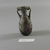 Roman. <em>Amphora-like Bottle of Blown Glass</em>, 1st-5th century C.E. Glass, 3 1/16 x 1 1/2 in. (7.8 x 3.8 cm). Brooklyn Museum, Gift of Robert B. Woodward, 01.65. Creative Commons-BY (Photo: Brooklyn Museum, CUR.01.65_view2.jpg)