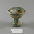 Roman. <em>Cup of Blown Green Glass</em>, 1st-5th century C.E. Glass, 1 7/8 x Diam. 2 1/4 in. (4.7 x 5.7 cm). Brooklyn Museum, Gift of Robert B. Woodward, 01.71. Creative Commons-BY (Photo: Brooklyn Museum, CUR.01.71_view1.jpg)