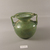 Roman. <em>Vase of Heavy Molded Green Glass</em>, 1st-5th century C.E. Glass, 6 1/8 x Diam. 5 11/16 in. (15.5 x 14.4 cm). Brooklyn Museum, Gift of Robert B. Woodward, 01.77. Creative Commons-BY (Photo: Brooklyn Museum, CUR.01.77_view2.jpg)