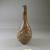 Roman. <em>Bottle with Stylized Grape Pattern</em>, 3rd century C.E. Glass, Greatest diam. 3 5/16 x 7 7/16 in. (8.4 x 18.9 cm). Brooklyn Museum, Gift of Robert B. Woodward, 01.88. Creative Commons-BY (Photo: Brooklyn Museum, CUR.01.88_view1.jpg)