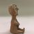 Tue-I (Pueblo Isleta). <em>Seated Figurine</em>, Late 19th - early 20th century. Clay, 5 1/4 × 2 1/2 × 3 in. (13.3 × 6.4 × 7.6 cm). Brooklyn Museum, Riggs Pueblo Pottery Fund, 02.257.2545. Creative Commons-BY (Photo: , CUR.02.257.2545_view04.jpg)