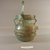 Roman. <em>Basket-shaped Vase of Blown Green Glass</em>, 2nd-5th century B.C.E. Glass, 7 1/16 x 4 1/16 in. (18 x 10.3 cm). Brooklyn Museum, Gift of Robert B. Woodward, 03.35. Creative Commons-BY (Photo: Brooklyn Museum, CUR.03.35_view1.jpg)