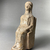 Possibly Greek. <em>Votive Statuette, Hollow, of a Female Seated on a Square Chair in Stiff Early Attitude</em>, 6th century B.C.E. Terracotta, pigment, 5 11/16 × 2 1/2 × 2 3/4 in. (14.5 × 6.3 × 7 cm). Brooklyn Museum, Purchase gift of Robert B. Woodward and Carll H. de Silver, 04.20. Creative Commons-BY (Photo: Brooklyn Museum, CUR.04.20_view03.jpeg)