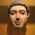  <em>Mummy Mask</em>, 150-200 C.E. Plaster, pigment, 9 7/16 x 7 1/16 x 5 1/2 in. (24 x 18 x 14 cm). Brooklyn Museum, Charles Edwin Wilbour Fund, 05.392. Creative Commons-BY (Photo: Brooklyn Museum, CUR.05.392_erg456.jpg)