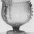Roman. <em>Vase of Light Olive-green Blown Glass</em>, 1st-4th century C.E. Glass, 7 1/2 x Diam. 6 7/8 in. (19 x 17.5 cm). Brooklyn Museum, Gift of R. B. Woodward, 05.41. Creative Commons-BY (Photo: Brooklyn Museum, CUR.05.41_negA_bw.jpg)