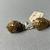 Greek. <em>Pair of Earrings</em>, 1st century B.C.E. Gold, 11/16 × 9/16 in. (1.7 × 1.4 cm). Brooklyn Museum, Ella C. Woodward Memorial Fund, 05.460.1-.2. Creative Commons-BY (Photo: Brooklyn Museum, CUR.05.460.1-.2_detail02.JPG)
