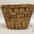 Tsilhqot'in. <em>Coiled Burden Basket</em>, 1901-1933. Wood, spruce root, grass stems (Phragmites sp.), hide, cedar root, 9 5/8 × 14 5/8 × 10 1/8 in. (24.4 × 37.1 × 25.7 cm). Brooklyn Museum, Museum Expedition 1905, Museum Collection Fund, 05.588.7245. Creative Commons-BY (Photo: Brooklyn Museum, CUR.05.588.7245_overall02.JPG)