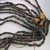 Hupa. <em>String of Beads</em>. Pine nuts, string, cotton cloth, 1 9/16 x 3 15/16 x 35 7/16 in.  (4.0 x 10.0 x 90.0 cm). Brooklyn Museum, Museum Expedition 1905, Museum Collection Fund, 05.588.7476. Creative Commons-BY (Photo: Brooklyn Museum, CUR.05.588.7476_detail.jpg)
