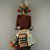 A:shiwi (Zuni Pueblo). <em>Kachina Doll (Kja-kja-lih)</em>, late 19th century. Wood, feather, cotton, pigment, wool yarn, plant fiber, 14 15/16 x 4 13/16 x 4 3/16 in. (37.9 x 12.2 x 10.6 cm). Brooklyn Museum, Museum Expedition 1907, Museum Collection Fund, 07.467.8425. Creative Commons-BY (Photo: Brooklyn Museum, CUR.07.467.8425_front.jpg)
