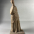 Possibly Greek. <em>Statue of a Woman</em>, in the style of 3rd century B.C.E. Terracotta, pigment, 8 5/16 × 3 5/8 × 2 3/8 in. (21.1 × 9.2 × 6 cm). Brooklyn Museum, Gift of A. Augustus Healy, 09.15. Creative Commons-BY (Photo: Brooklyn Museum, CUR.09.15_view01.jpeg)