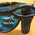  <em>Wadjet-eye Amulet</em>, 664–332 B.C.E. Faience, 3 1/2 x 5 1/8 x 9/16 in. (8.9 x 13 x 1.4 cm). Brooklyn Museum, Museum Collection Fund, 09.877. Creative Commons-BY (Photo: Brooklyn Museum, CUR.09.877_pqg.jpg)