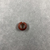  <em>Penannular Earring or Hair Ring</em>. Carnelian, 3/16 × 9/16 in. (0.5 × 1.4 cm). Brooklyn Museum, Charles Edwin Wilbour Fund, 09.889.839.4. Creative Commons-BY (Photo: , CUR.09.889.839.4_view01.jpg)